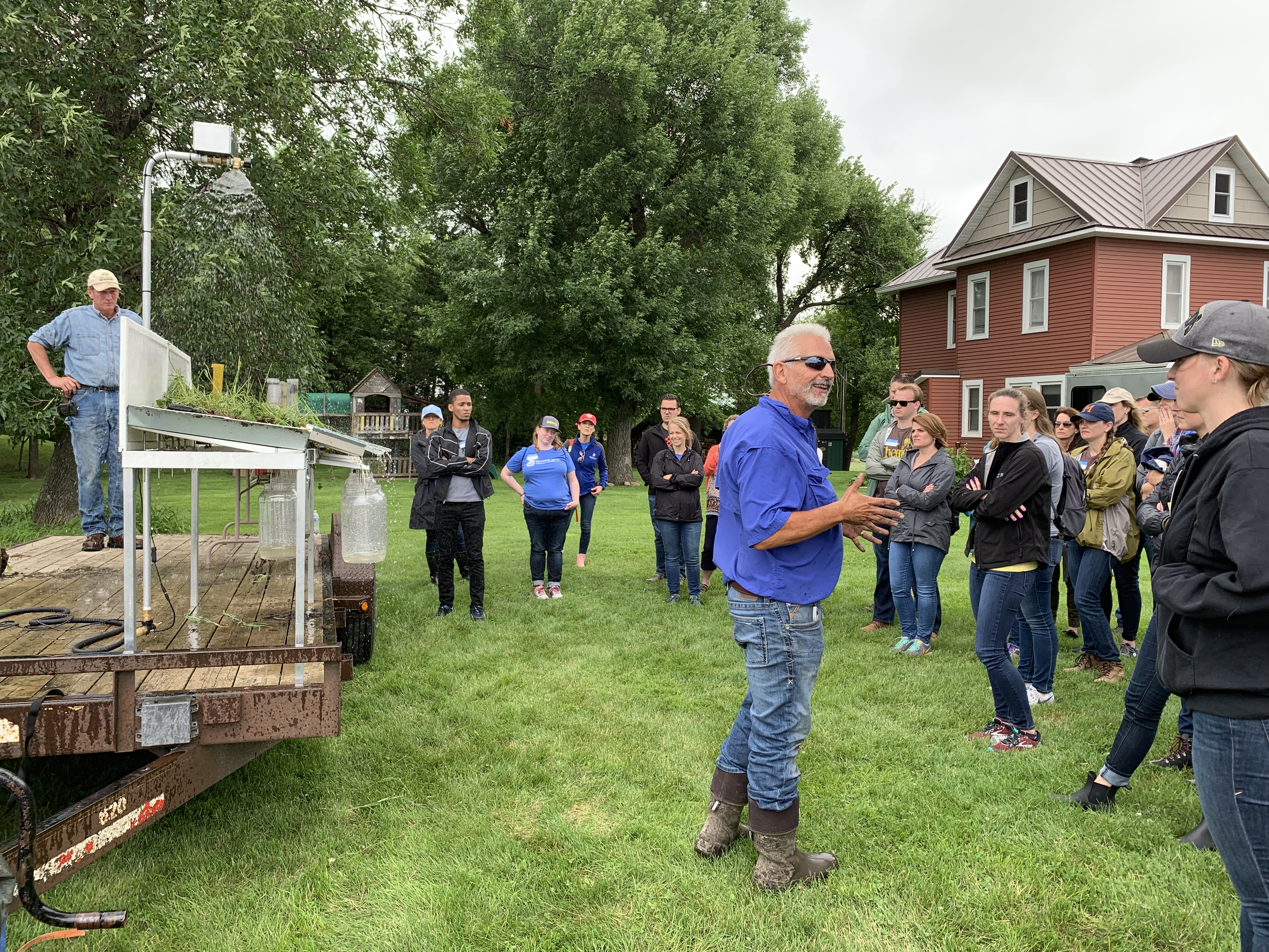 employees listening to soil demo