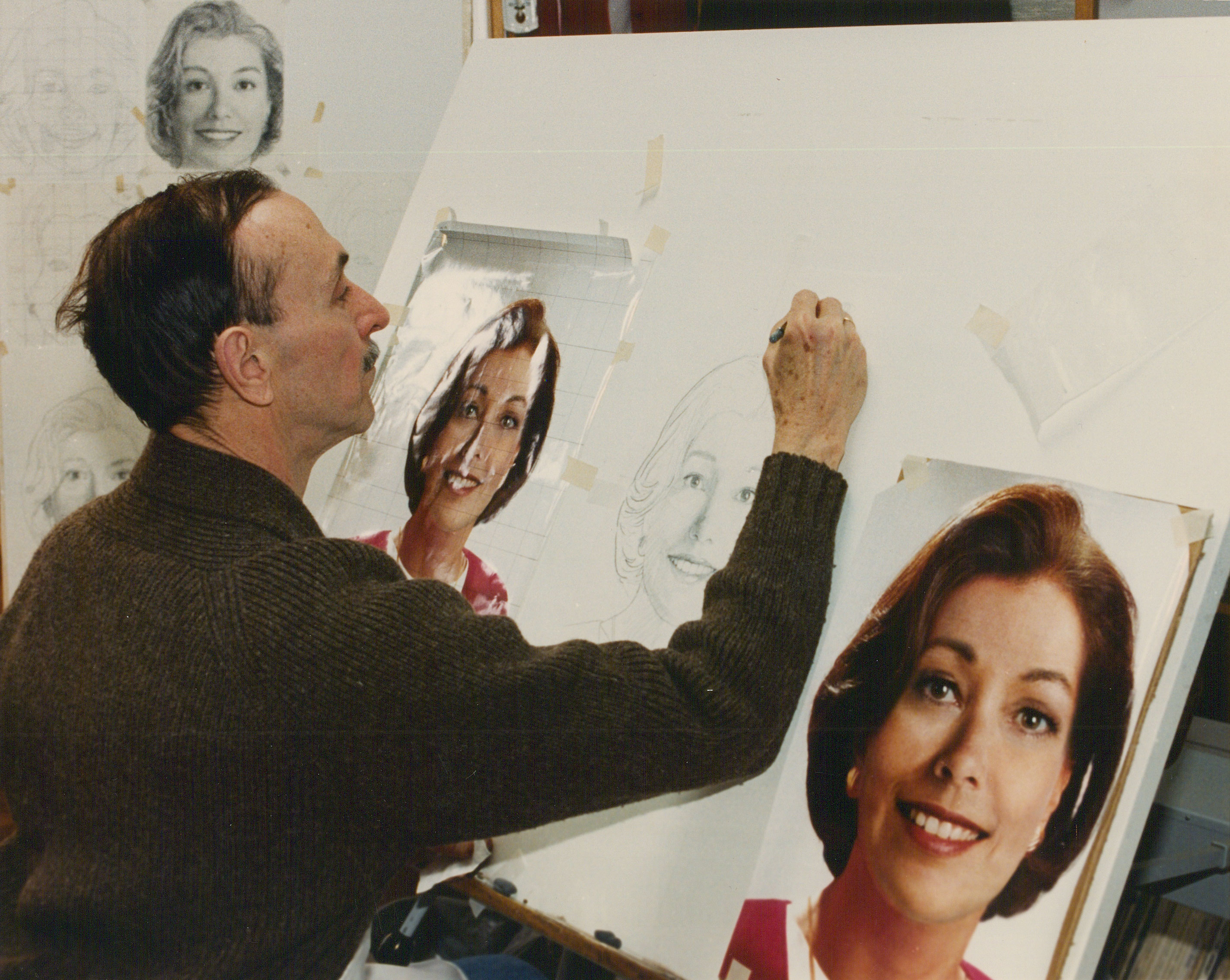 An artist sketching one of the official portraits of Betty Crocker.